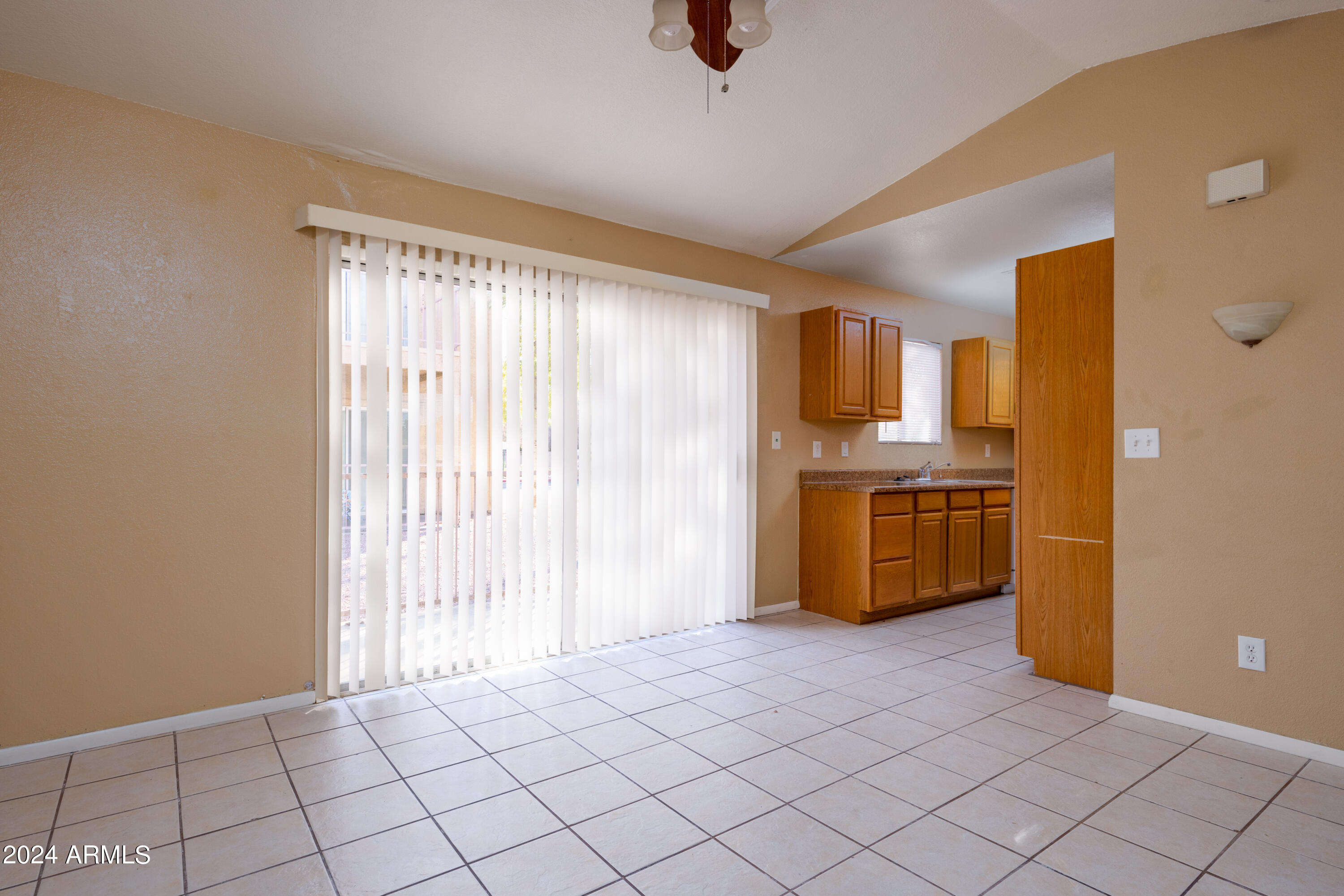 653 West Guadalupe Road, Unit 1121 Mesa, AZ 85210 - Photo 5 of 27 a view of kitchen with window and refrigerator