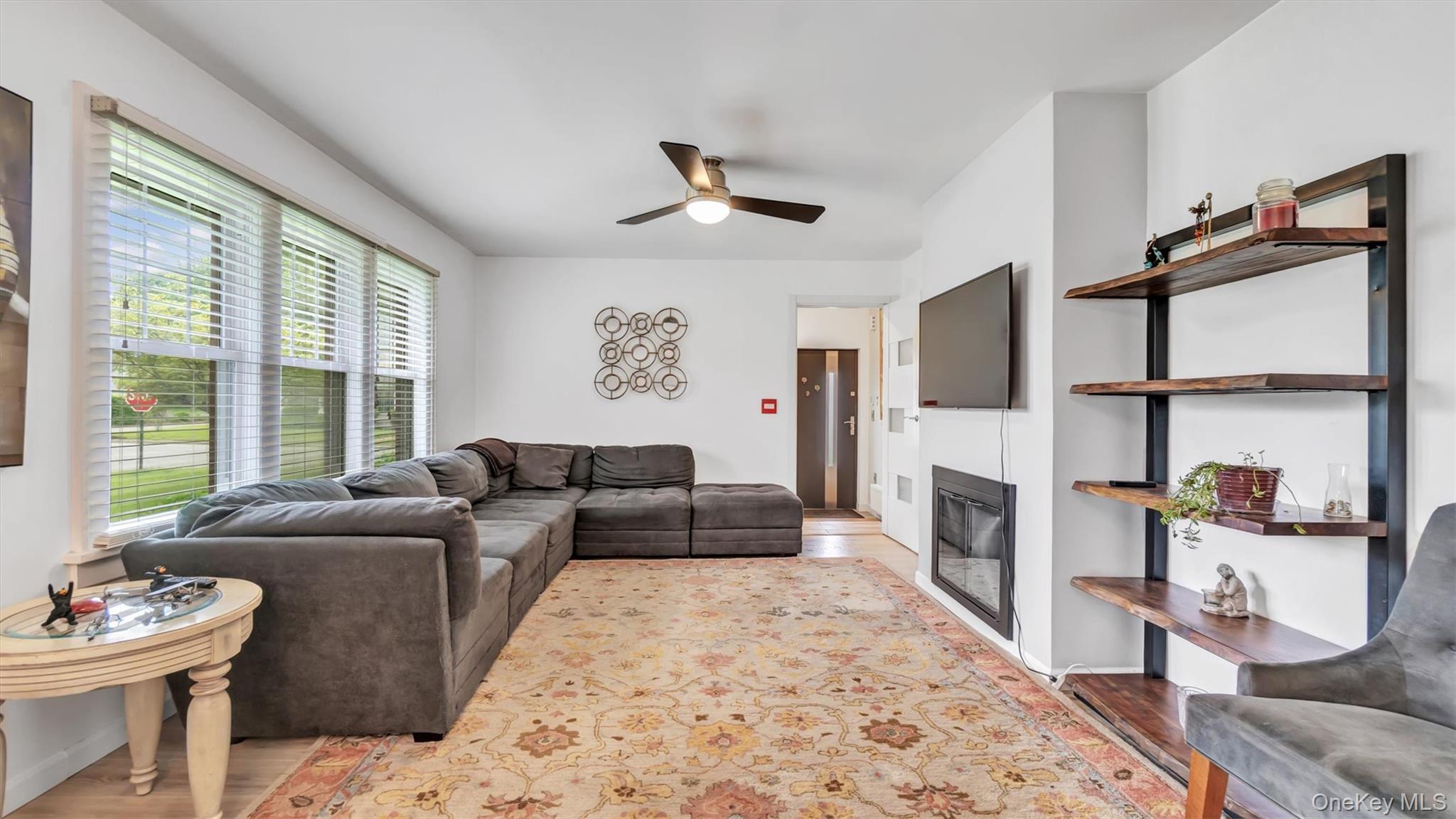 143 Hallock Street Riverhead, NY 11901 - Photo 11 of 39 a living room with furniture fireplace and window