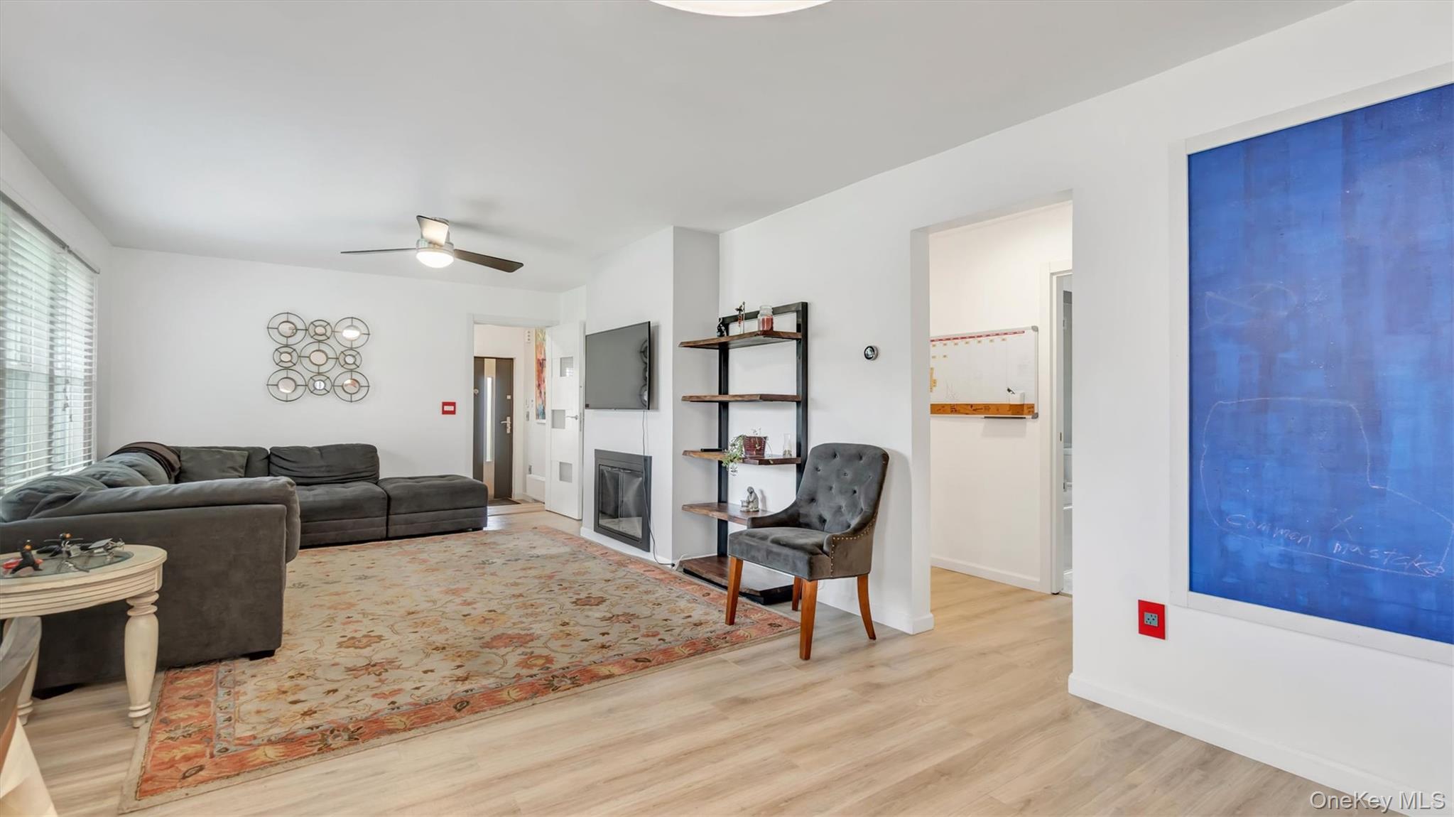 143 Hallock Street Riverhead, NY 11901 - Photo 12 of 39 a living room with furniture and wooden floor