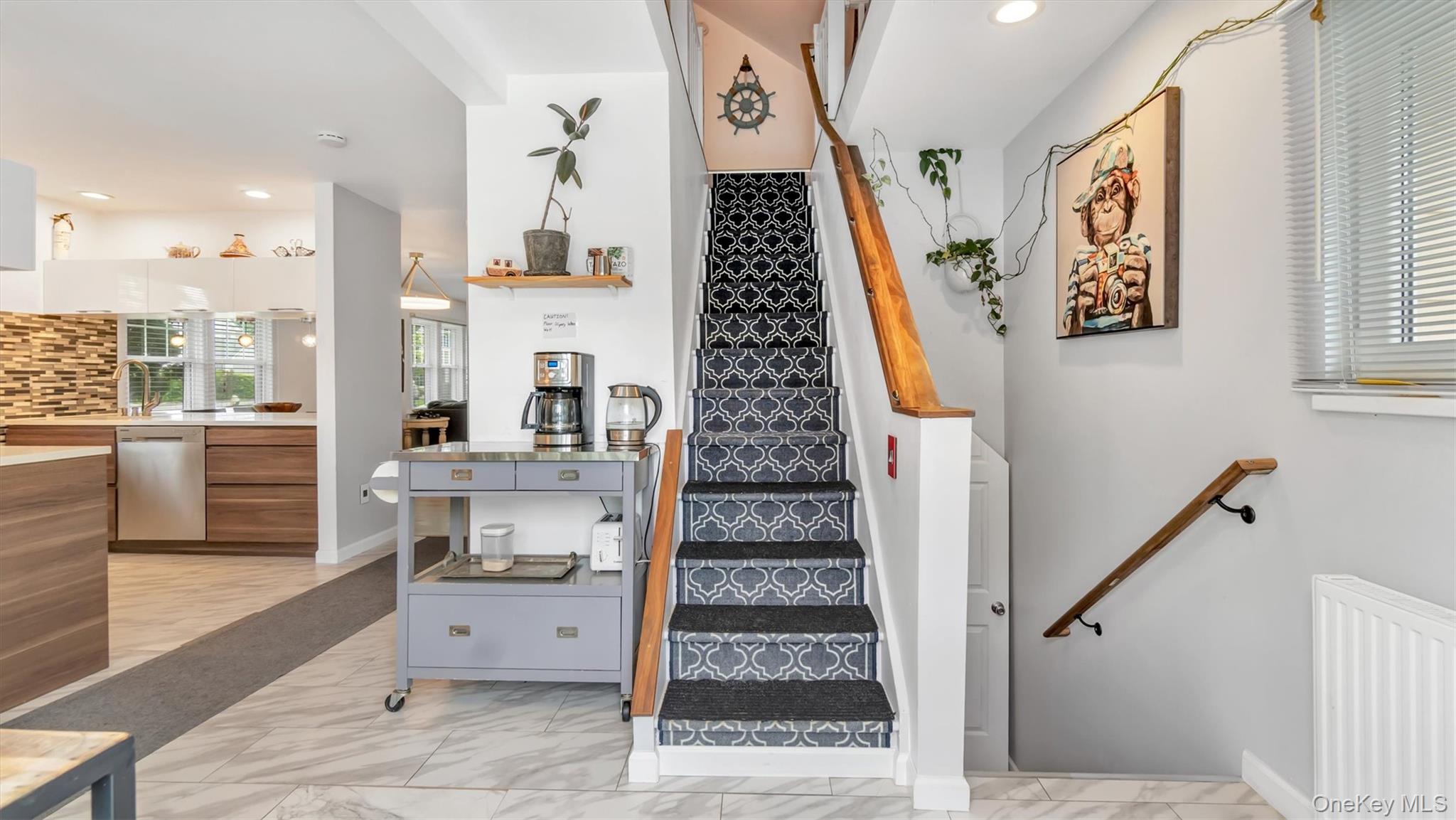 143 Hallock Street Riverhead, NY 11901 - Photo 18 of 39 a view of hallway with stairs and wooden floor