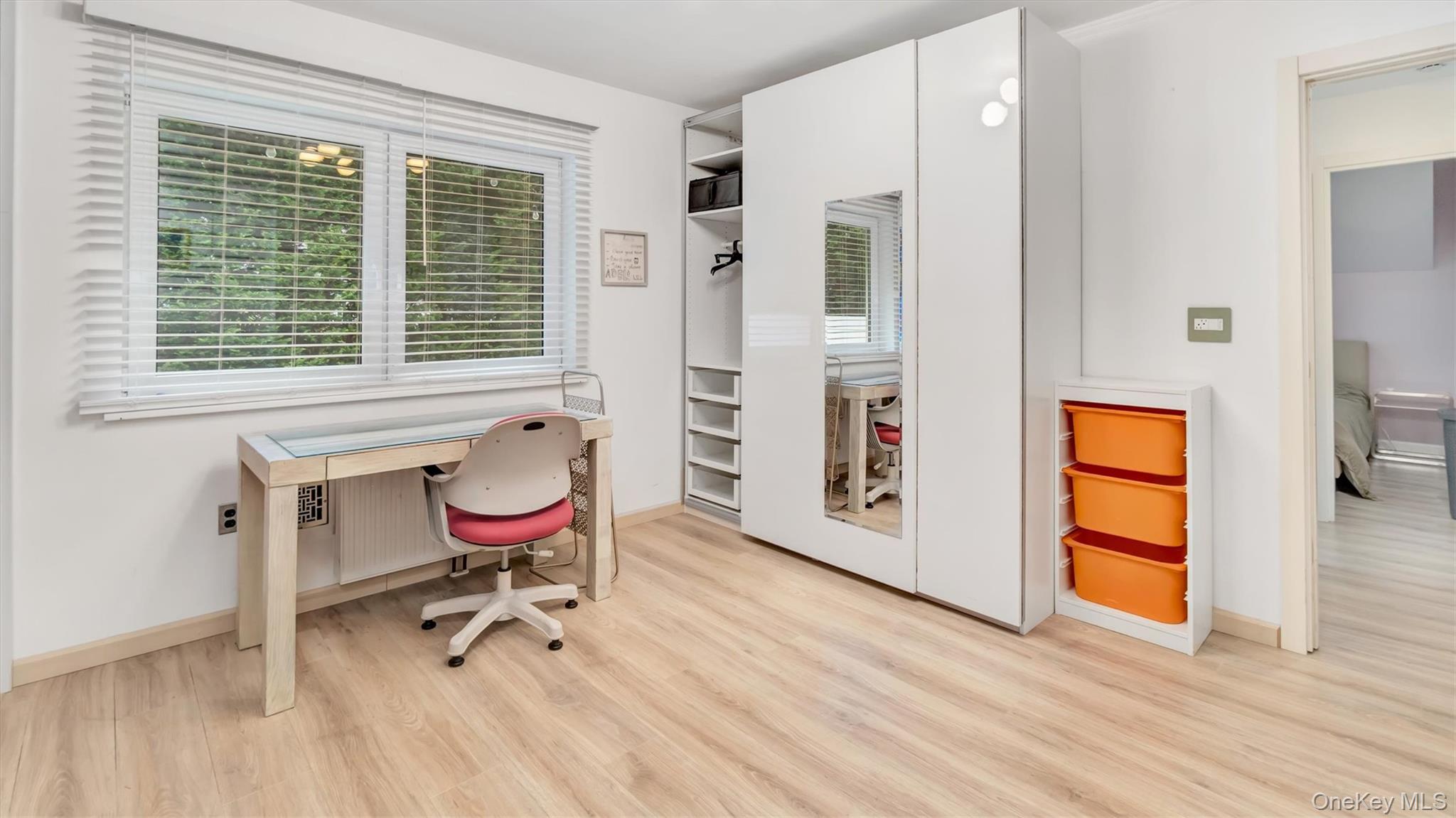143 Hallock Street Riverhead, NY 11901 - Photo 20 of 39 a workspace with furniture and a window