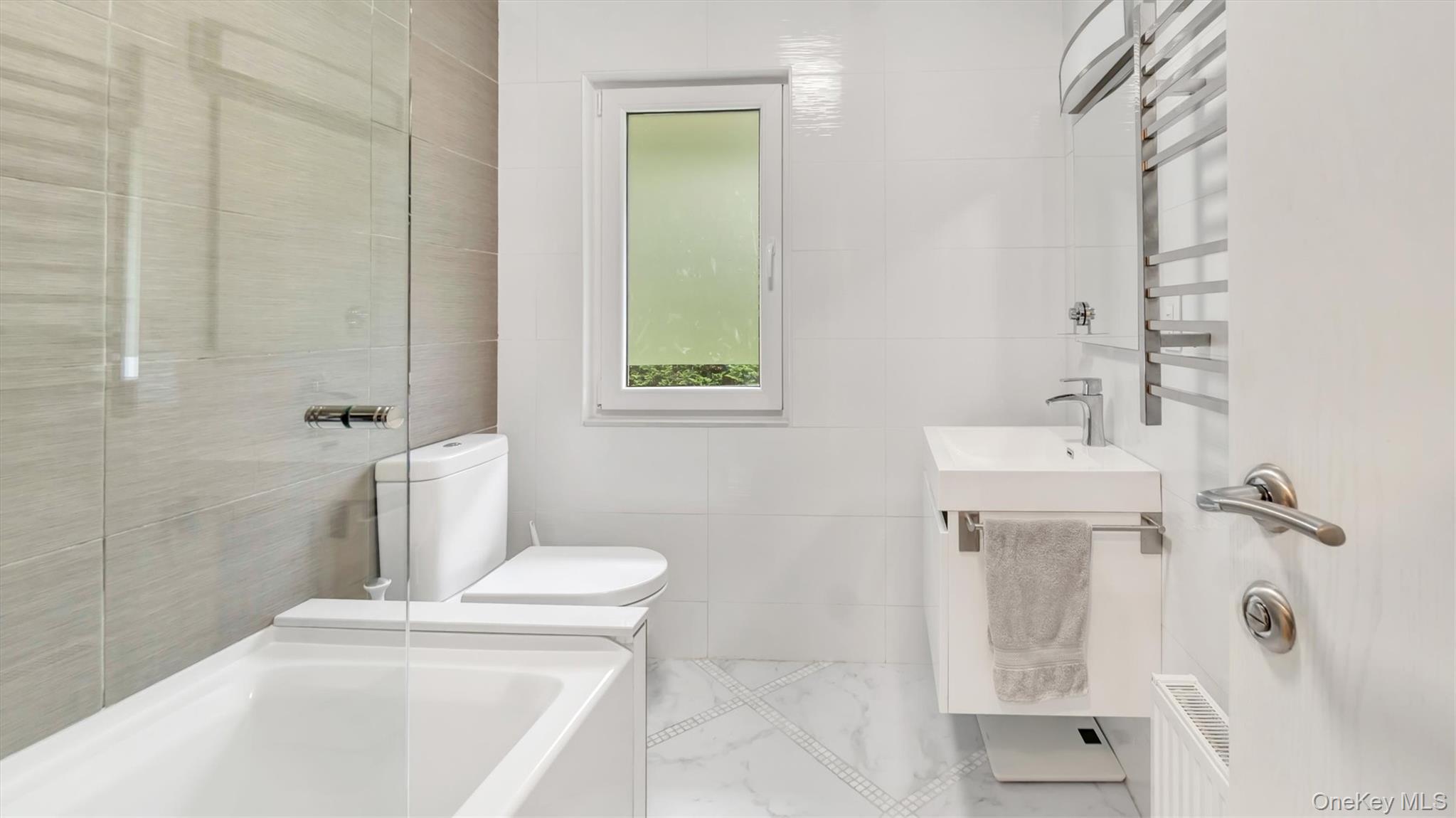 143 Hallock Street Riverhead, NY 11901 - Photo 21 of 39 a bathroom with a sink a toilet and shower