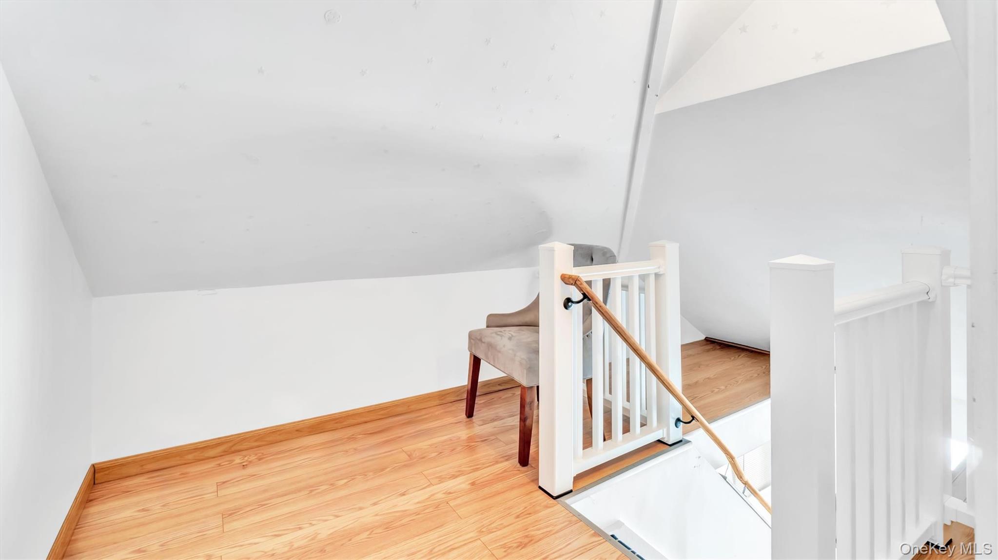 143 Hallock Street Riverhead, NY 11901 - Photo 23 of 39 a view of a room with stairs and white walls