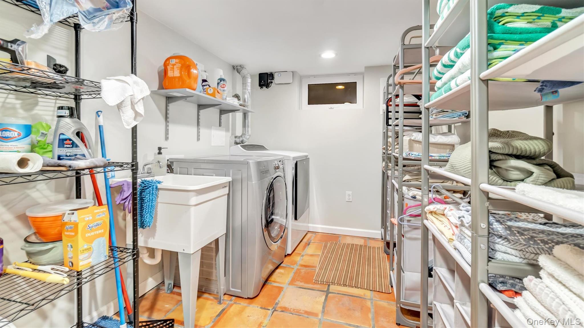 143 Hallock Street Riverhead, NY 11901 - Photo 27 of 39 a utility room with dryer and washer