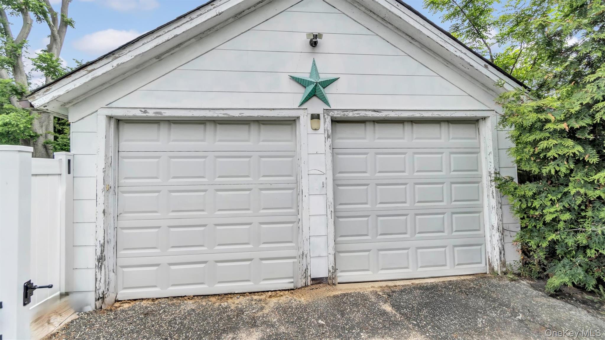 143 Hallock Street Riverhead, NY 11901 - Photo 33 of 39 a front view of a house with a garage