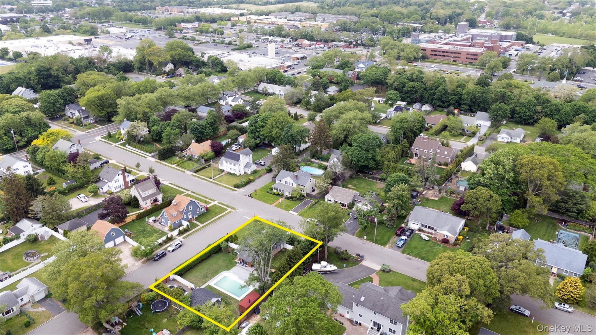 143 Hallock Street Riverhead, NY 11901 - Photo 35 of 39 an aerial view of a city with lots of residential buildings
