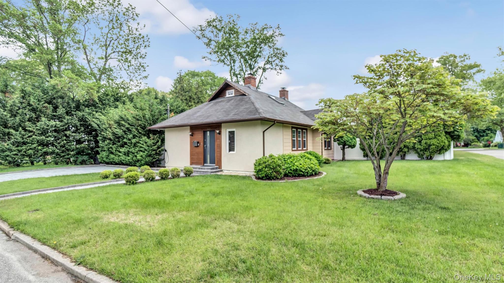 143 Hallock Street Riverhead, NY 11901 - Photo 7 of 39 a house with garden in front of it