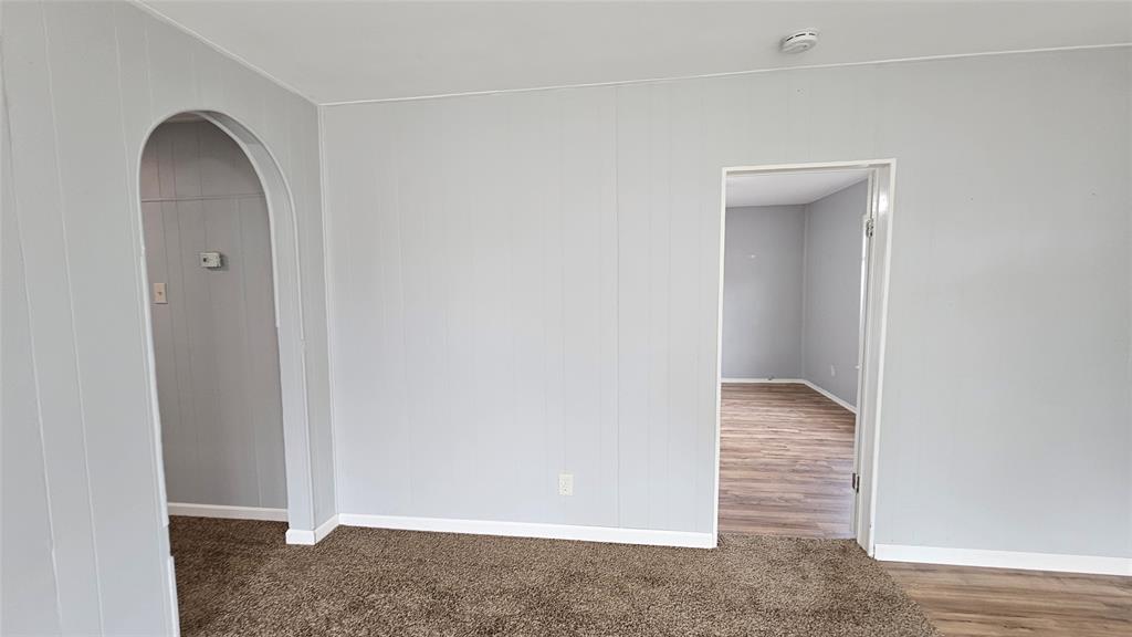 904 Duncan Street Denton, TX 76205 - Photo 11 of 40 an empty room with wooden floor and closet