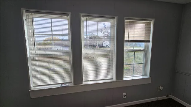 a view of hallway with wooden floor