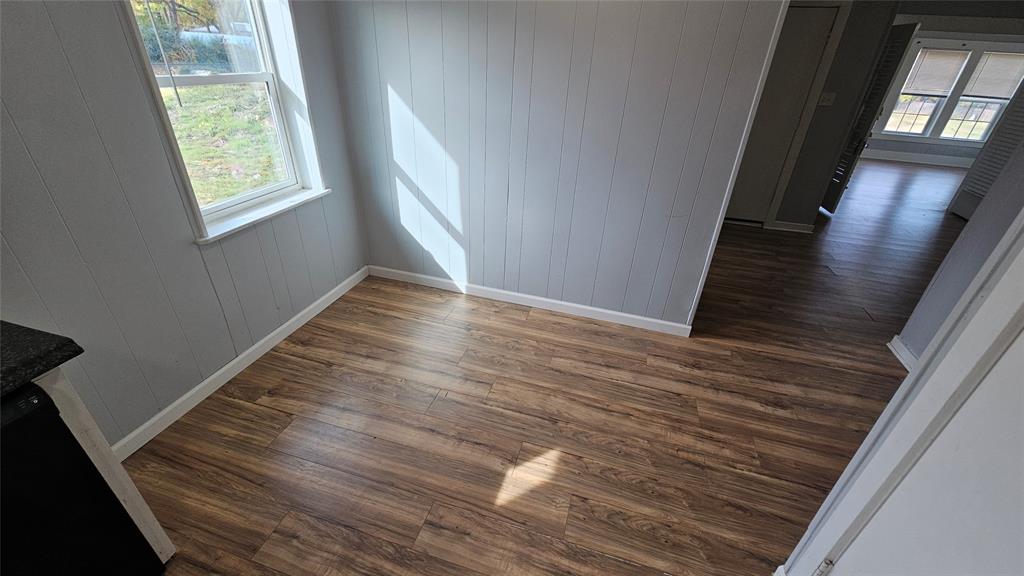 904 Duncan Street Denton, TX 76205 - Photo 22 of 40 a view of an empty room with wooden floor and a window