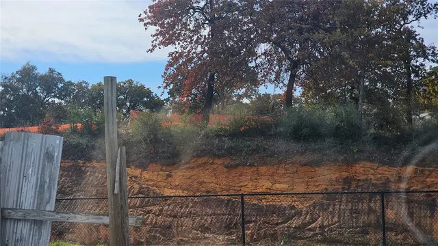 a kitchen with a refrigerator and a stove top oven