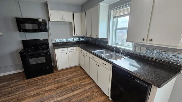 a kitchen with a stove and a refrigerator