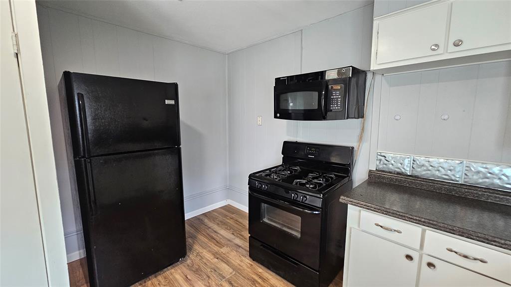 904 Duncan Street Denton, TX 76205 - Photo 28 of 40 a kitchen with a stove and a refrigerator