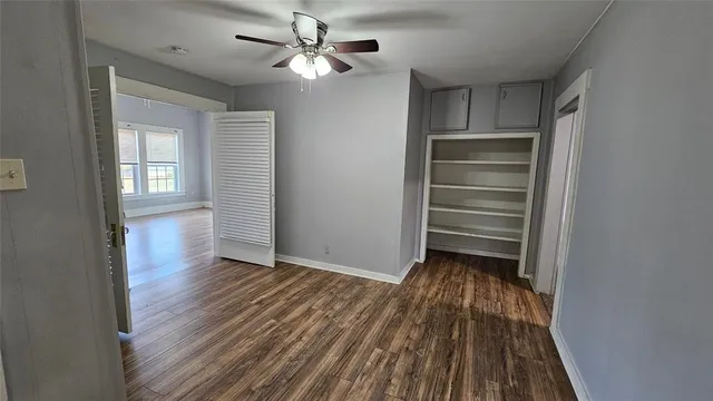 a bathroom with a sink toilet a mirror and vanity