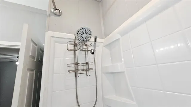 a bathroom with a toilet sink vanity granite and mirror