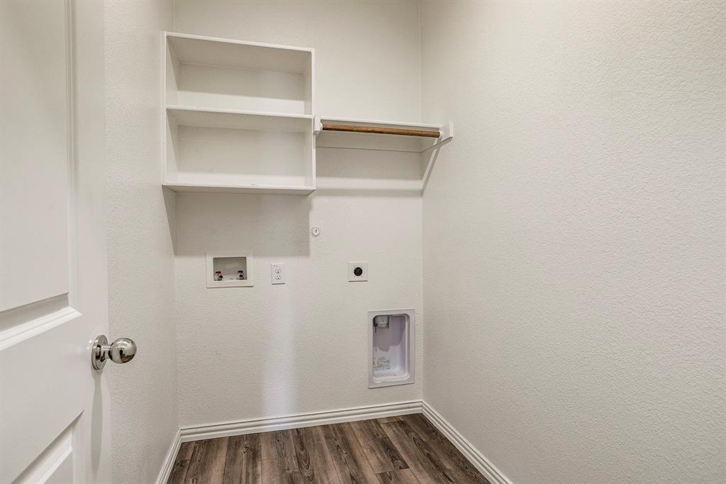 652 Ridgeback Trail Fort Worth, TX 76052 - Photo 12 of 20 Laundry area with dark hardwood / wood-style floors, washer hookup, hookup for an electric dryer, and hookup for a gas dryer