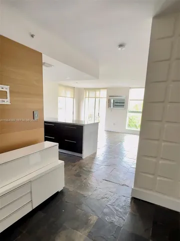 a spacious bathroom with a tub and shower