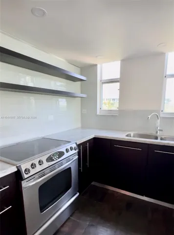a kitchen with a stove and a sink