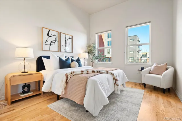 a bedroom with two beds and a couch