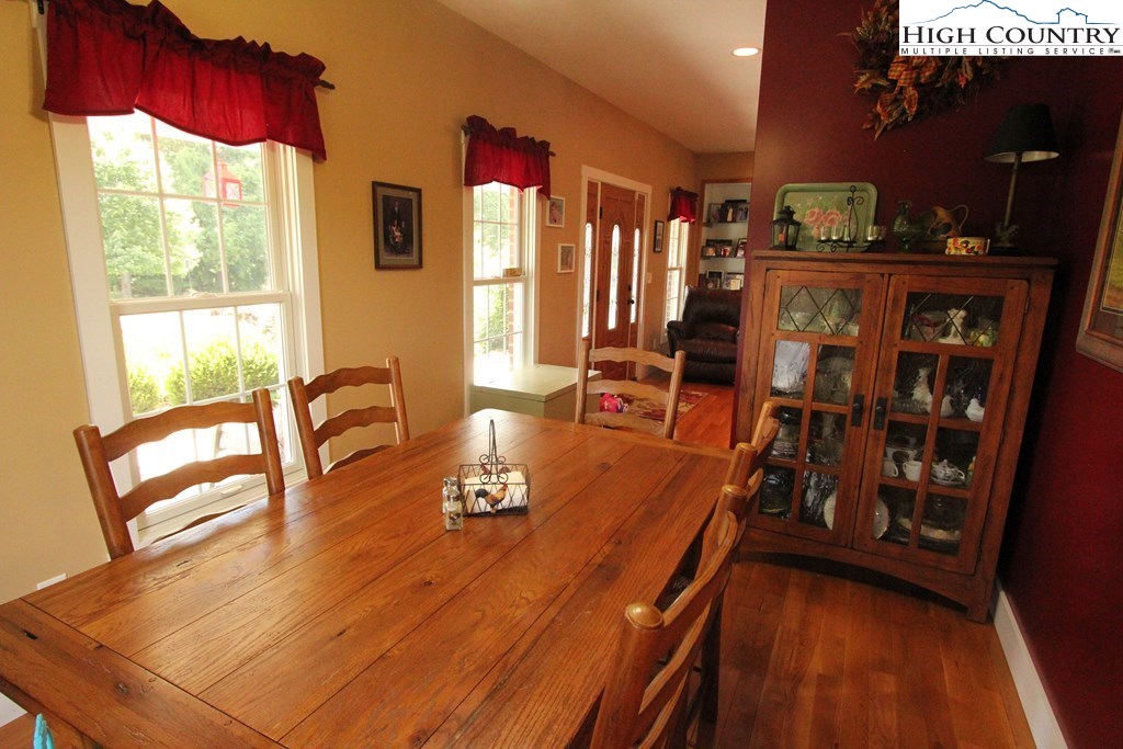 931 Graystone Road Independence, VA 24348 - Photo 14 of 32 a dining room with furniture and wooden floor