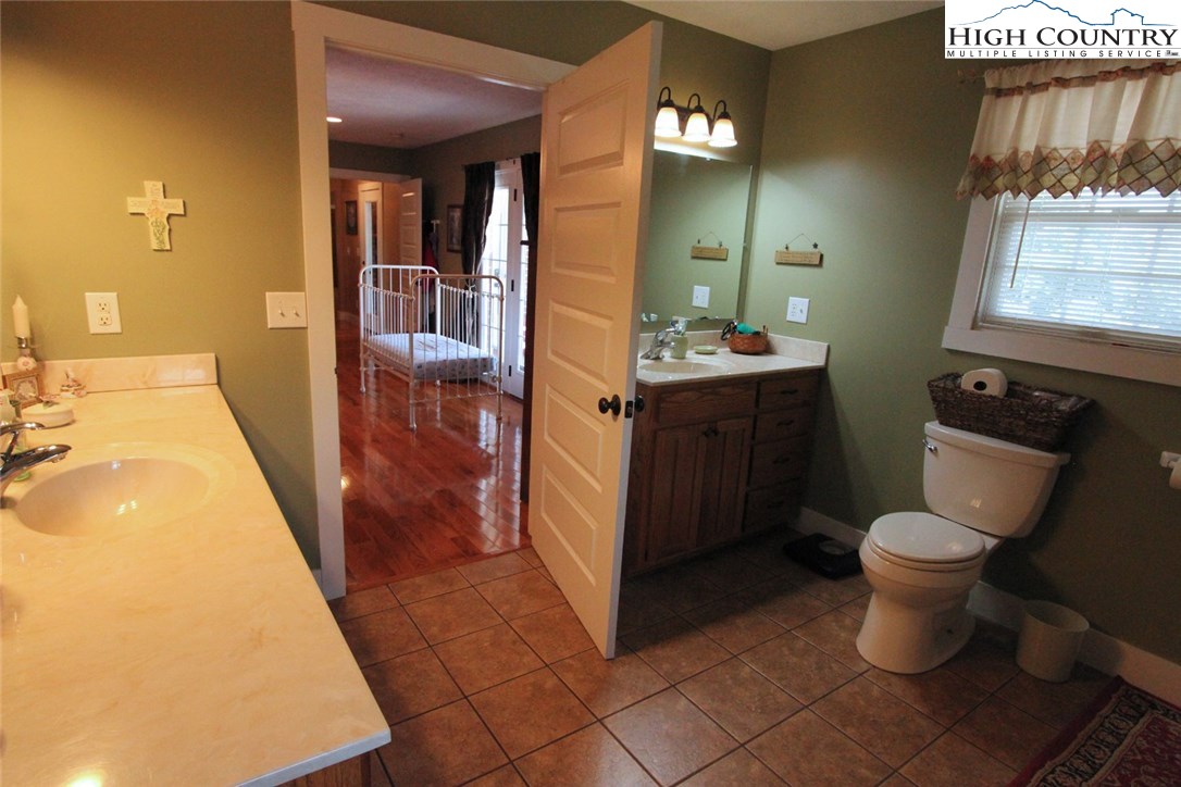 931 Graystone Road Independence, VA 24348 - Photo 18 of 32 a bathroom with a sink toilet and shower