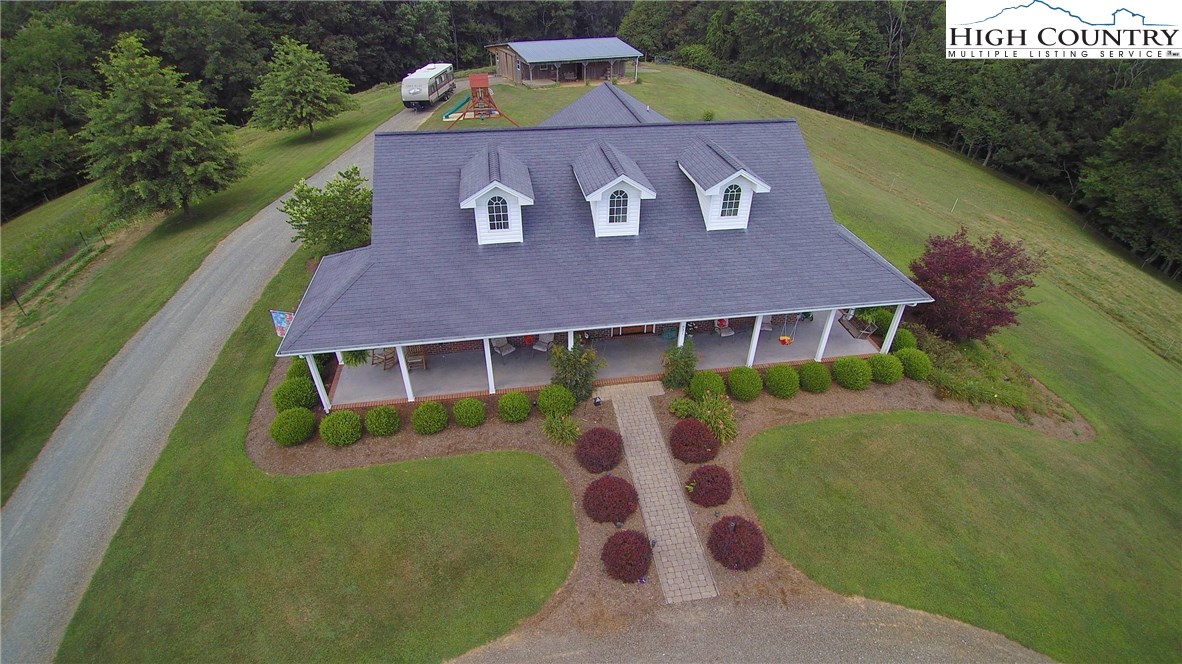 931 Graystone Road Independence, VA 24348 - Photo 2 of 32 a view of a house with a yard
