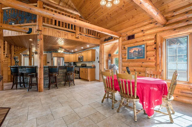 a kitchen with stainless steel appliances granite countertop a stove sink and cabinets