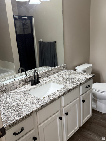 14797 South Chandlerpoint Way Draper, UT 84020 - Photo 16 of 33 Bathroom vanity featuring a white rectangular undermount sink, granite-style countertop, and matte black faucet