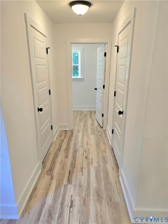 1737 Bumpass Road Bumpass, VA 23024 - Photo 21 of 26 a view of a room with wooden floor and white doors