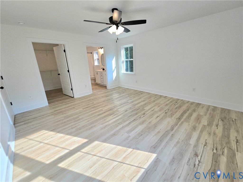 1737 Bumpass Road Bumpass, VA 23024 - Photo 25 of 26 wooden floor in an empty room with a window