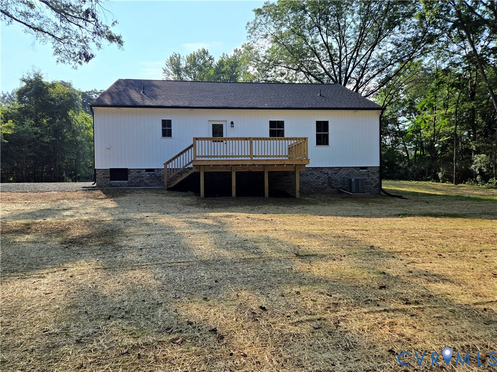 1737 Bumpass Road Bumpass, VA 23024 - Photo 7 of 26 a view of a house with backyard and a tree