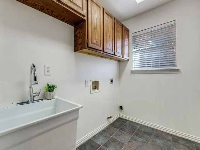 a bathroom with a sink and a window
