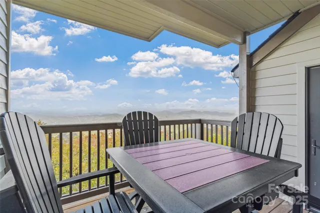 a view of a balcony with wooden floor