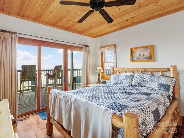 a bedroom with a large bed and a large window