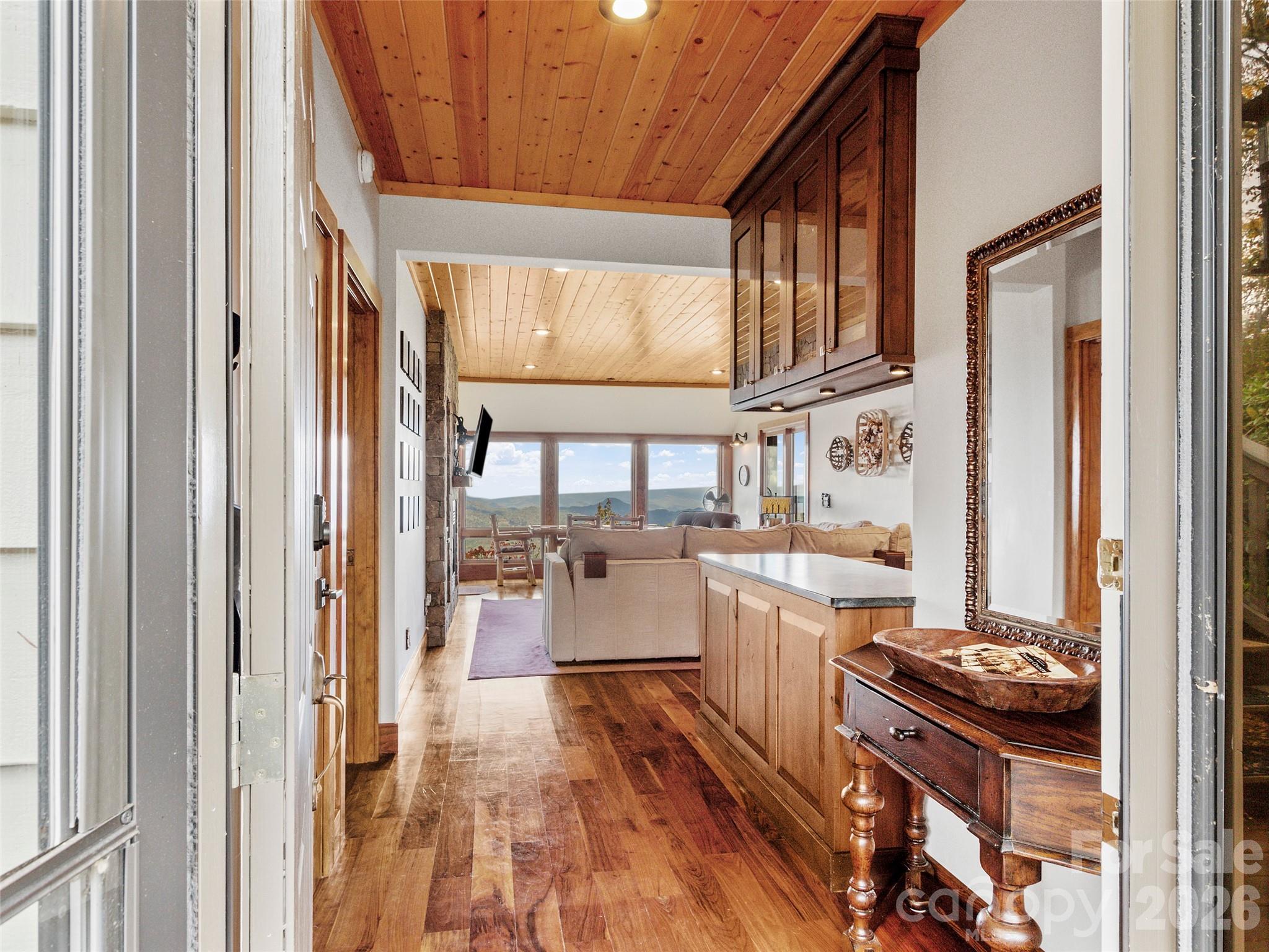 80 Slickrock Road, Unit A4 Burnsville, NC 28714 - Photo 2 of 30 a kitchen with a lot of cabinets and wooden floor
