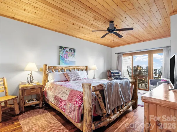 a bed room with a bed and a chandelier