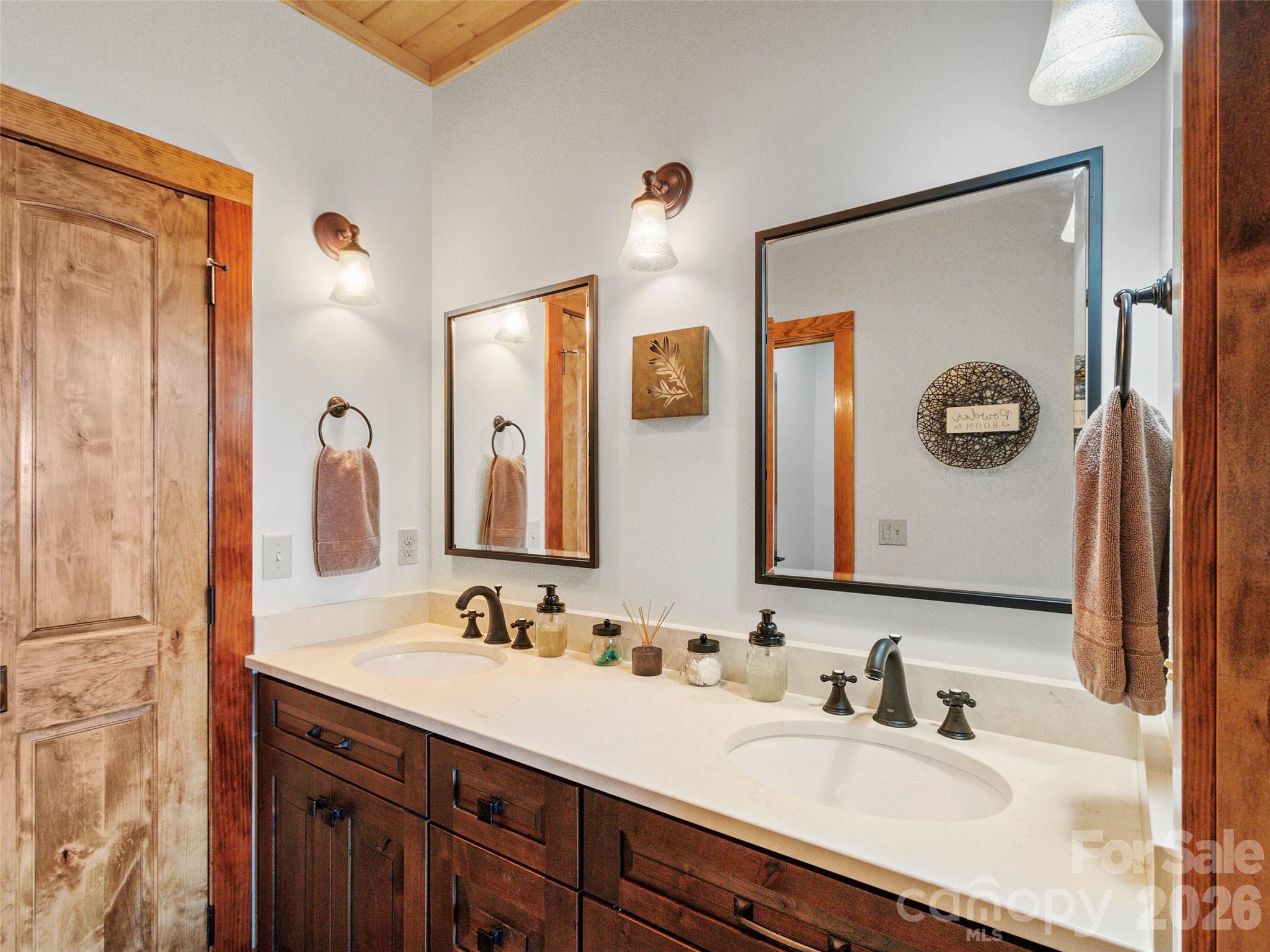 80 Slickrock Road, Unit A4 Burnsville, NC 28714 - Photo 26 of 30 a bathroom with a double vanity sink and a mirror