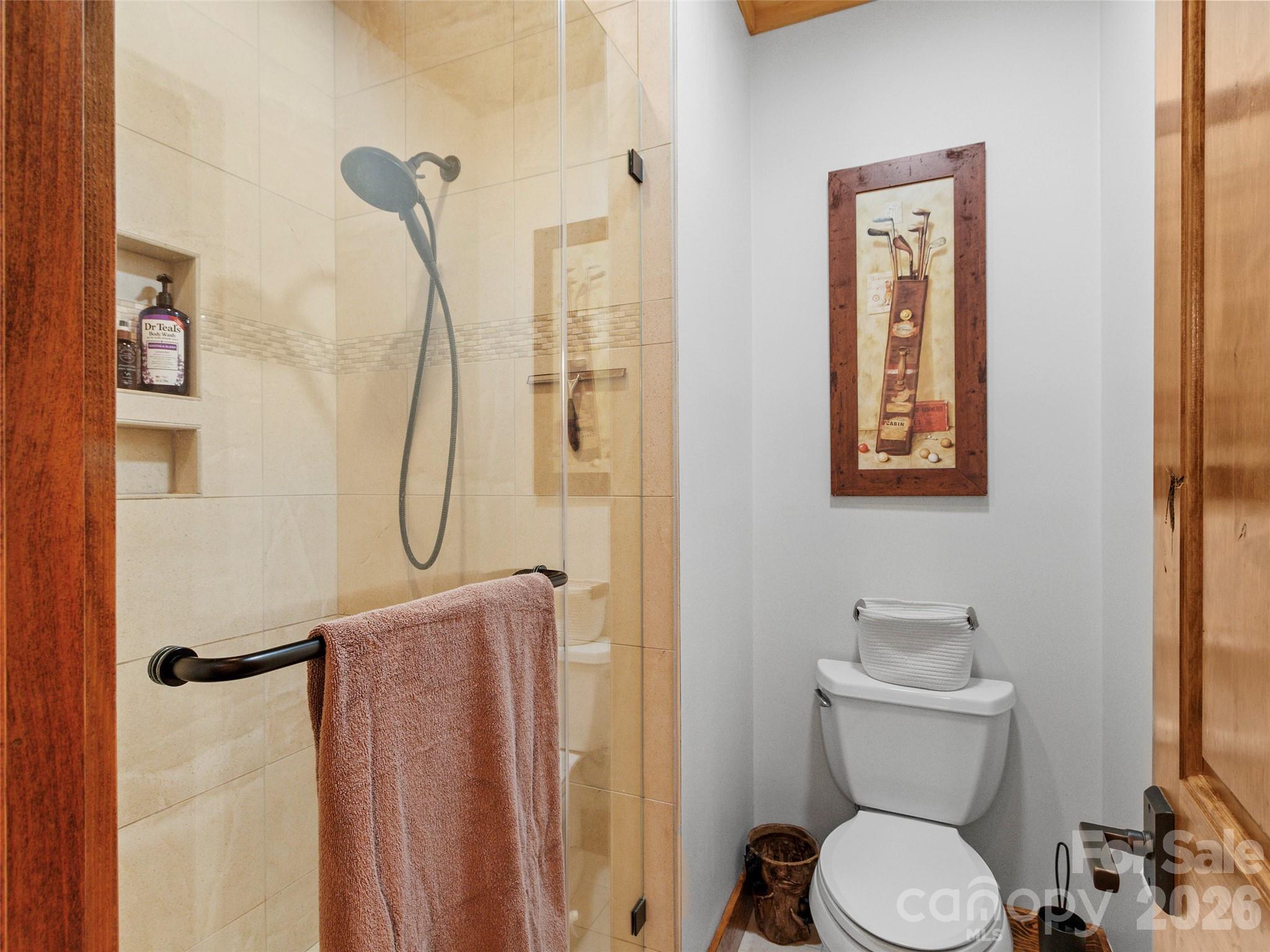 80 Slickrock Road, Unit A4 Burnsville, NC 28714 - Photo 27 of 30 a bathroom with a toilet sink and shower