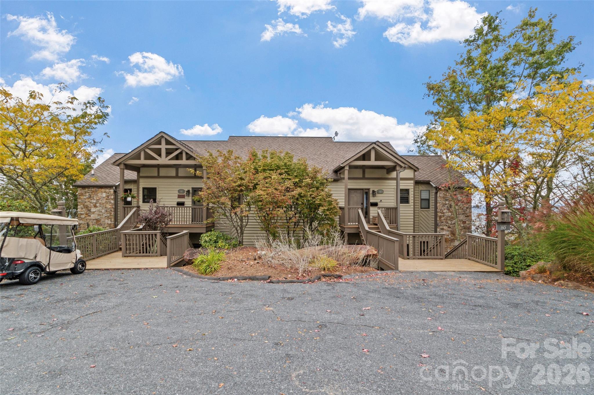 80 Slickrock Road, Unit A4 Burnsville, NC 28714 - Photo 29 of 30 a view of a house with a yard and sitting area