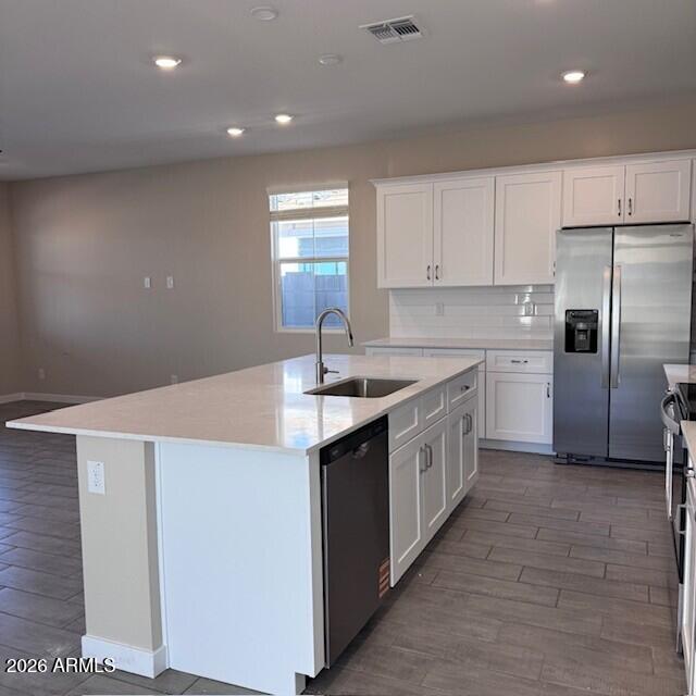 24194 West Atlantis Way Buckeye, AZ 85326 - Photo 5 of 9 a kitchen with a sink a counter top space stainless steel appliances and cabinets