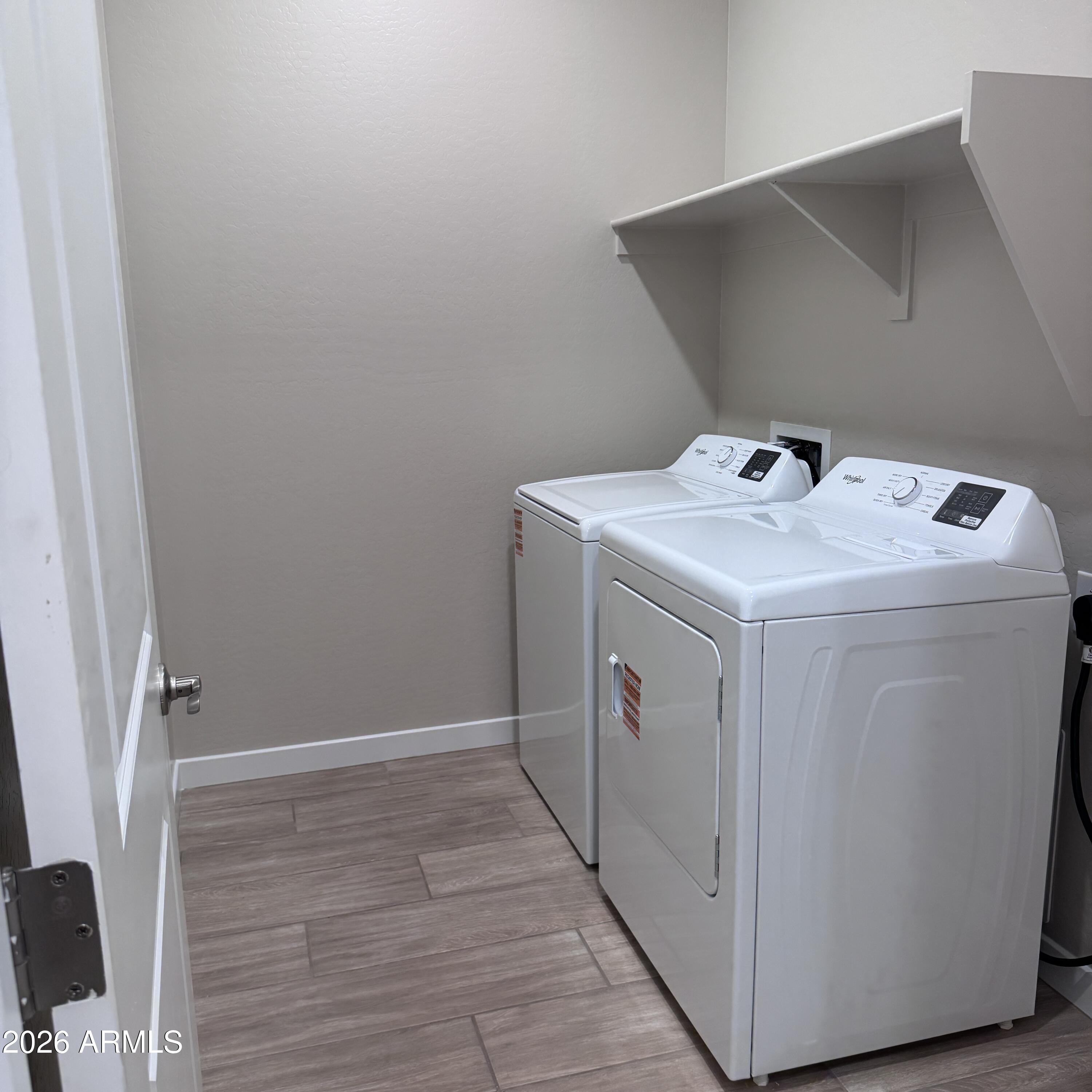 24194 West Atlantis Way Buckeye, AZ 85326 - Photo 7 of 9 a utility room with dryer and washer