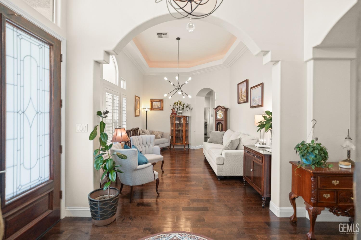 Undisclosed Address Bakersfield, CA 93311 - Photo 13 of 53 a living room with furniture a chandelier and a chandelier