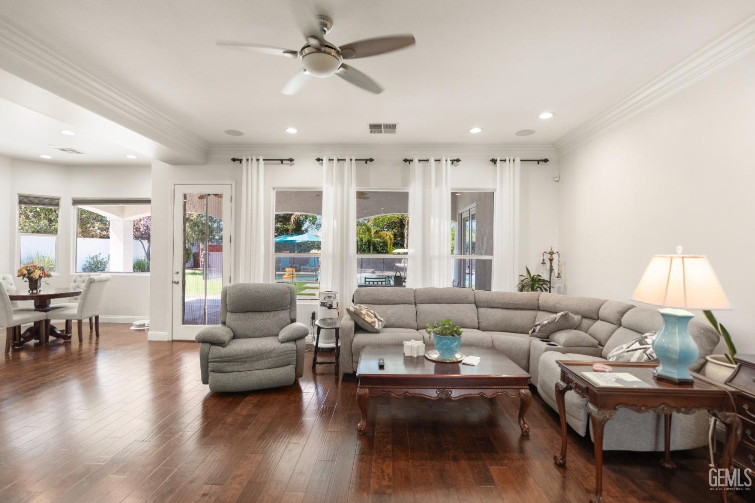 Undisclosed Address Bakersfield, CA 93311 - Photo 21 of 53 a living room with furniture and wooden floor