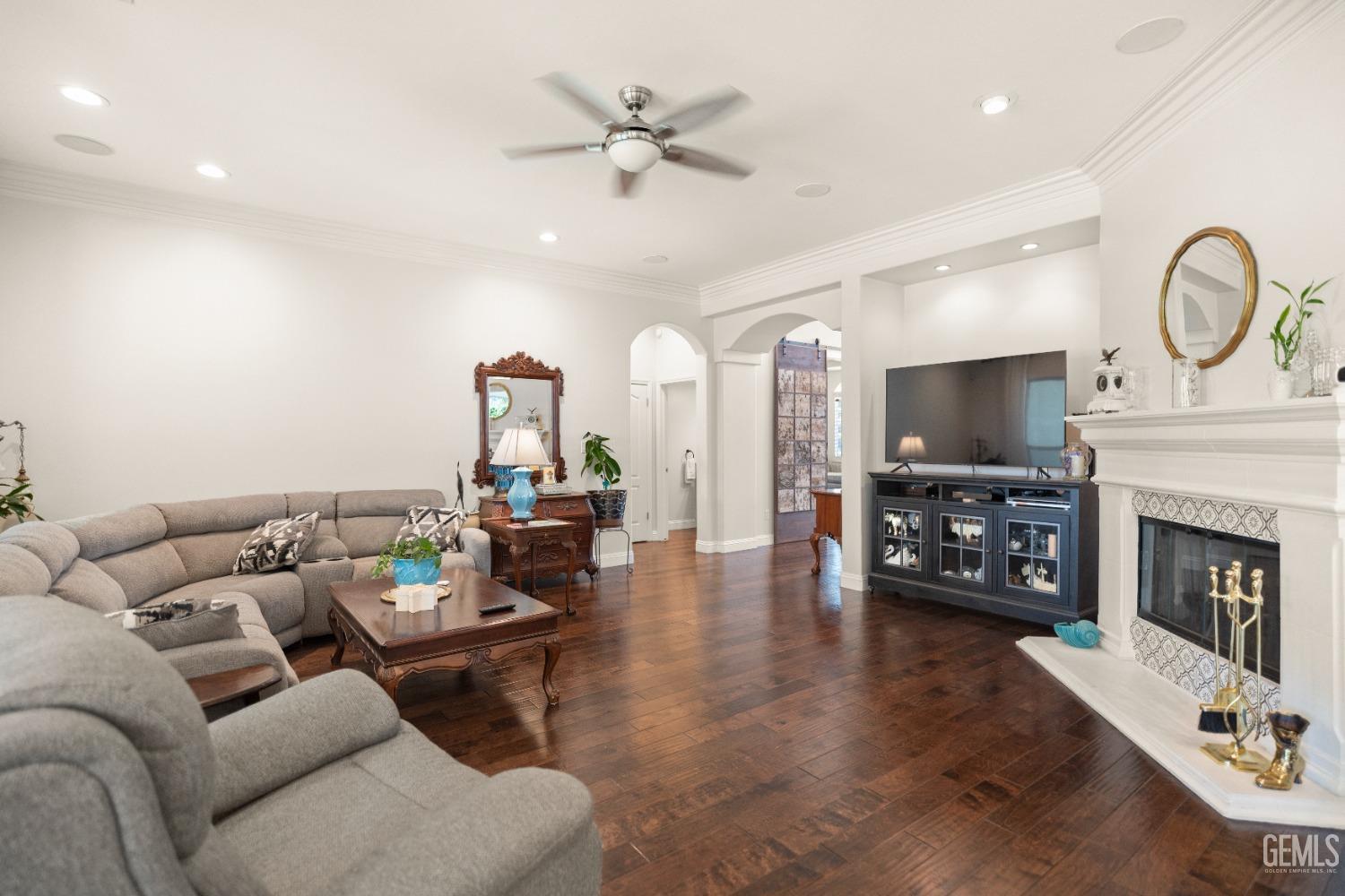 Undisclosed Address Bakersfield, CA 93311 - Photo 22 of 53 a living room with furniture a fireplace and a flat screen tv