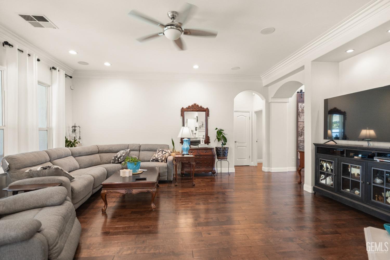 Undisclosed Address Bakersfield, CA 93311 - Photo 23 of 53 a living room with furniture and wooden floor