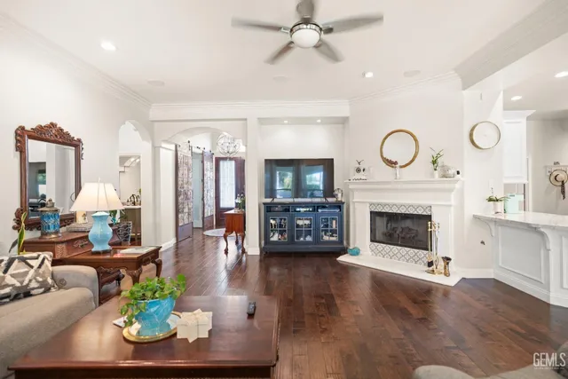 a bedroom with furniture and a wooden floor