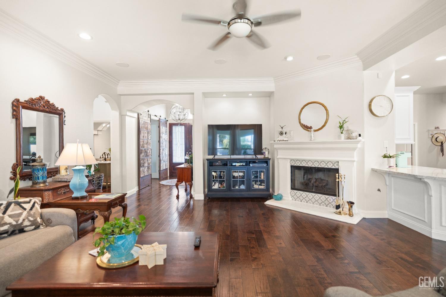 Undisclosed Address Bakersfield, CA 93311 - Photo 24 of 53 a living room with furniture a fireplace and a flat screen tv