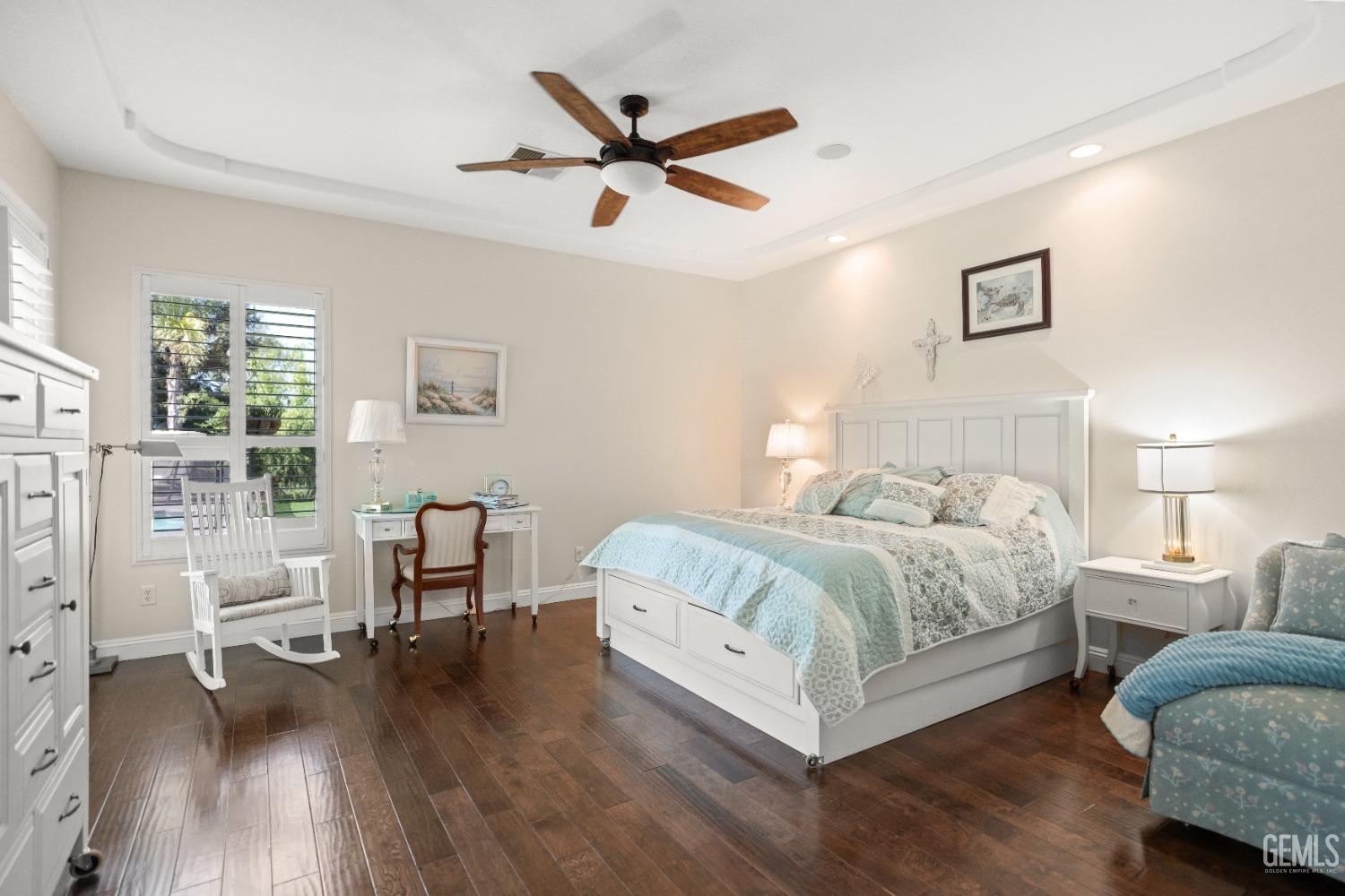 Undisclosed Address Bakersfield, CA 93311 - Photo 26 of 53 a bedroom with furniture and a wooden floor