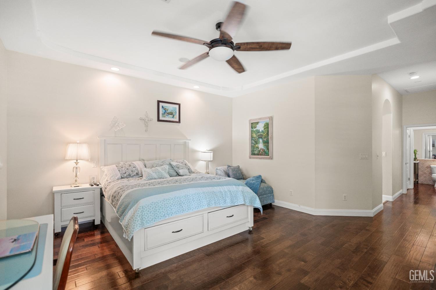 Undisclosed Address Bakersfield, CA 93311 - Photo 27 of 53 a bedroom with a bed and a ceiling fan