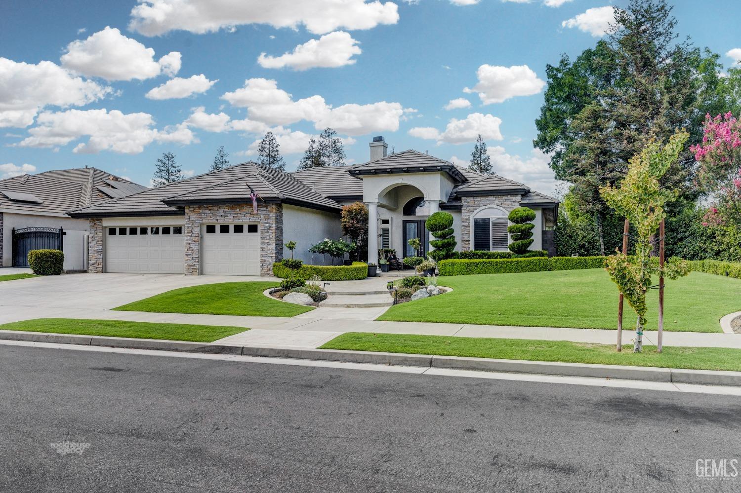 Undisclosed Address Bakersfield, CA 93311 - Photo 3 of 53 a front view of a house with a yard and entertaining space